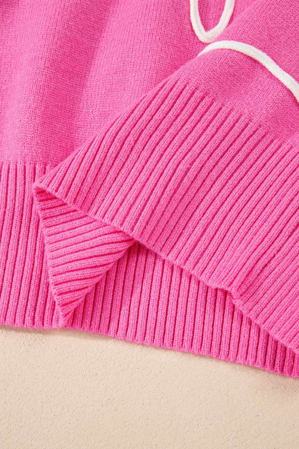 Pink bow round neck dropped shoulder sweater with ribbed cuffs and hem.
