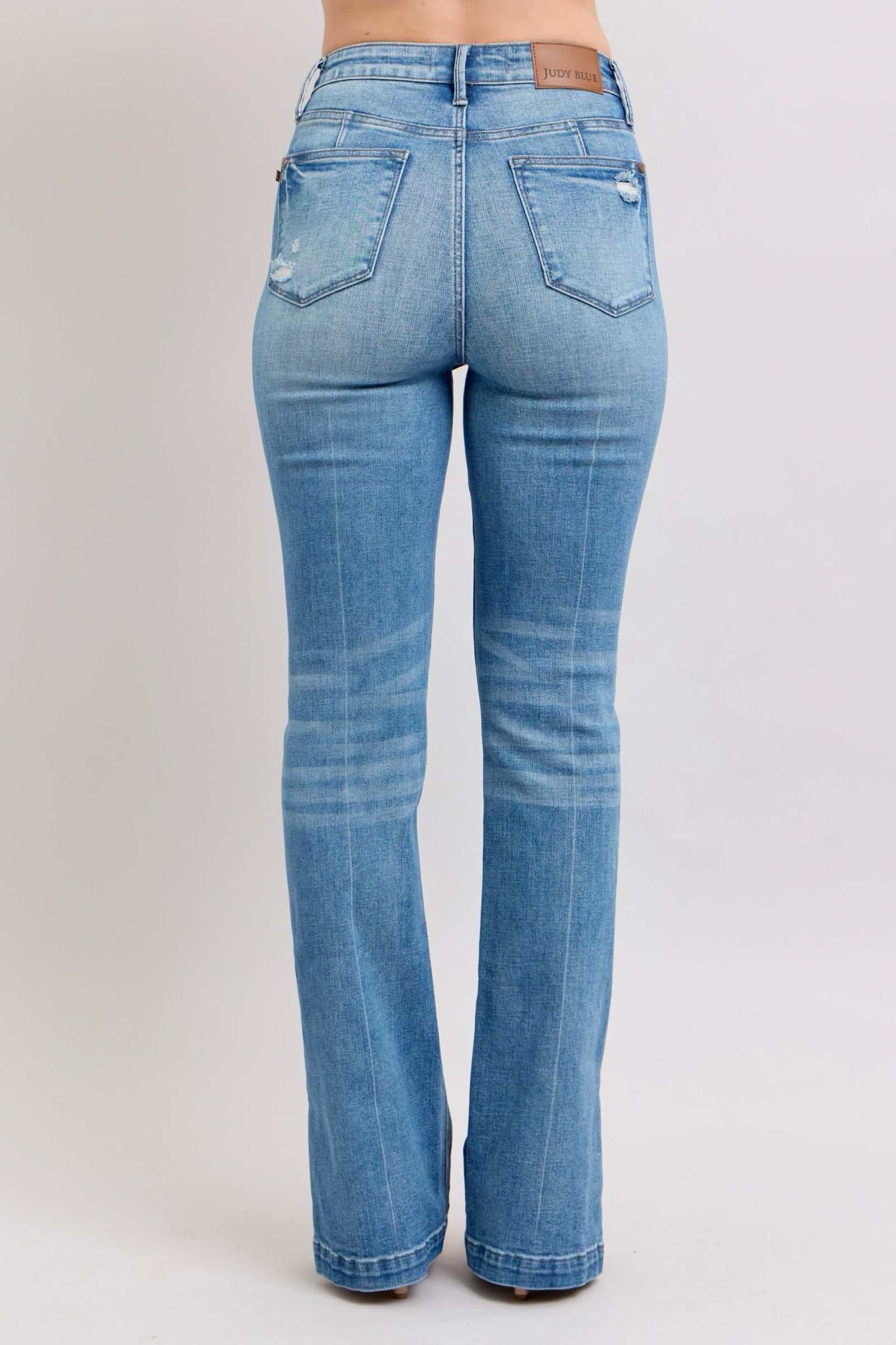 Back view of Judy Blue HW tummy control vintage wash slim bootcut jeans with side slit detailing.