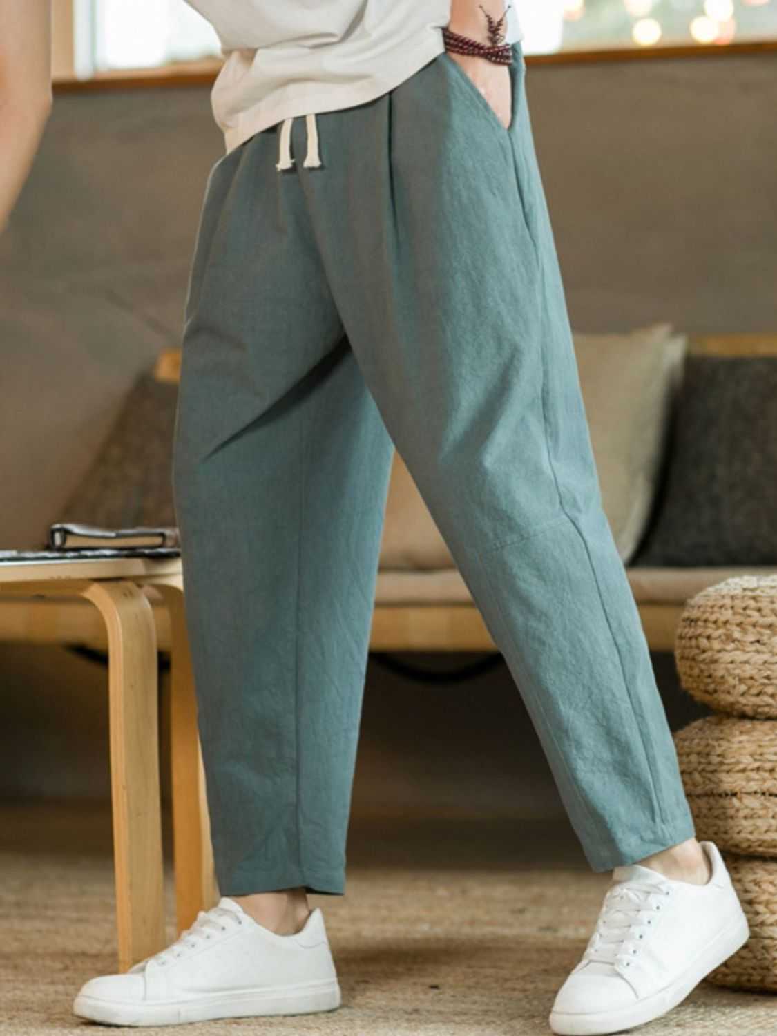 Plus size drawstring pants with pockets in blue on person, casual style.