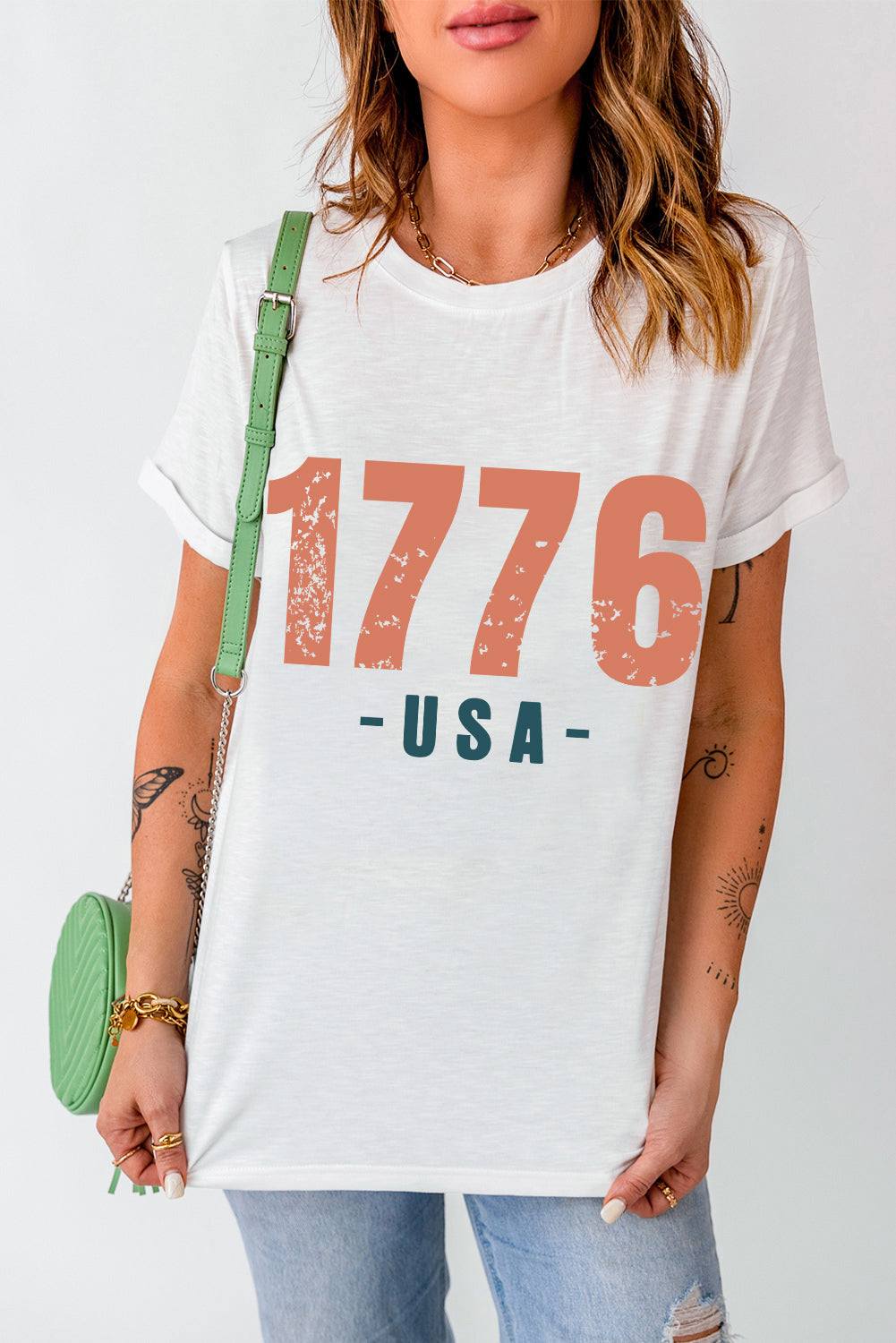 Graphic round neck short sleeve T-shirt showing "1776 USA" design.