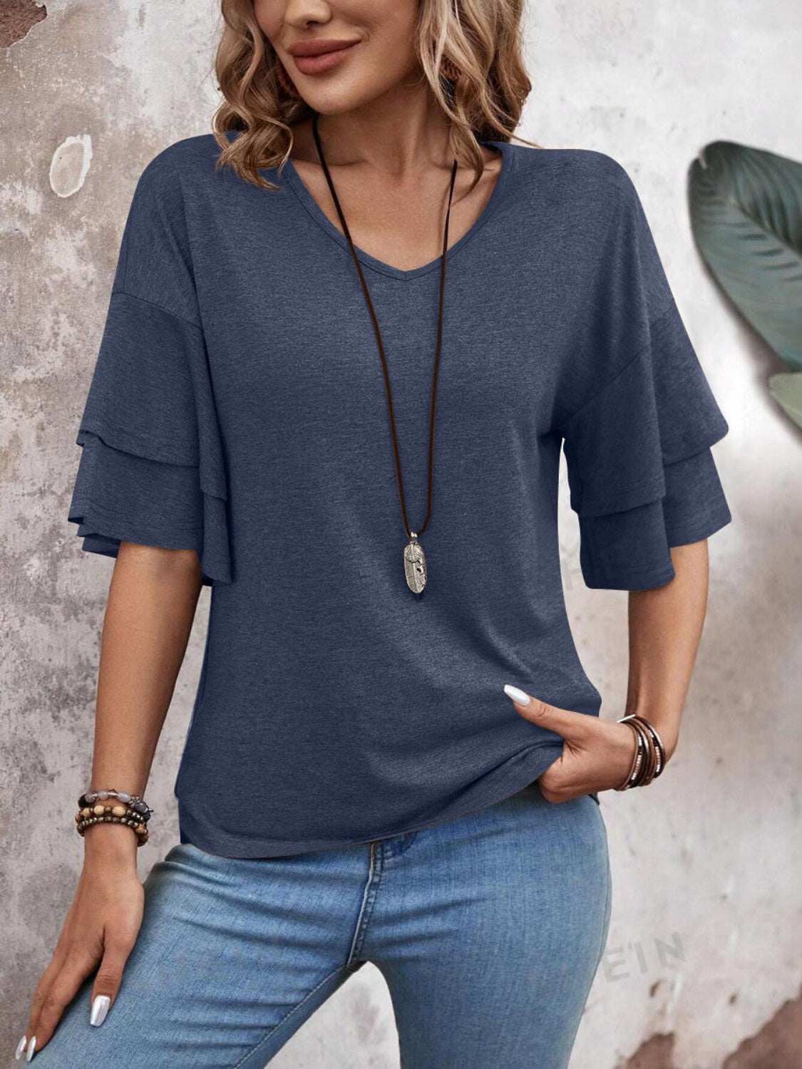 V-Neck half sleeve blouse, basic style, slightly stretchy, polyester-rayon blend.
