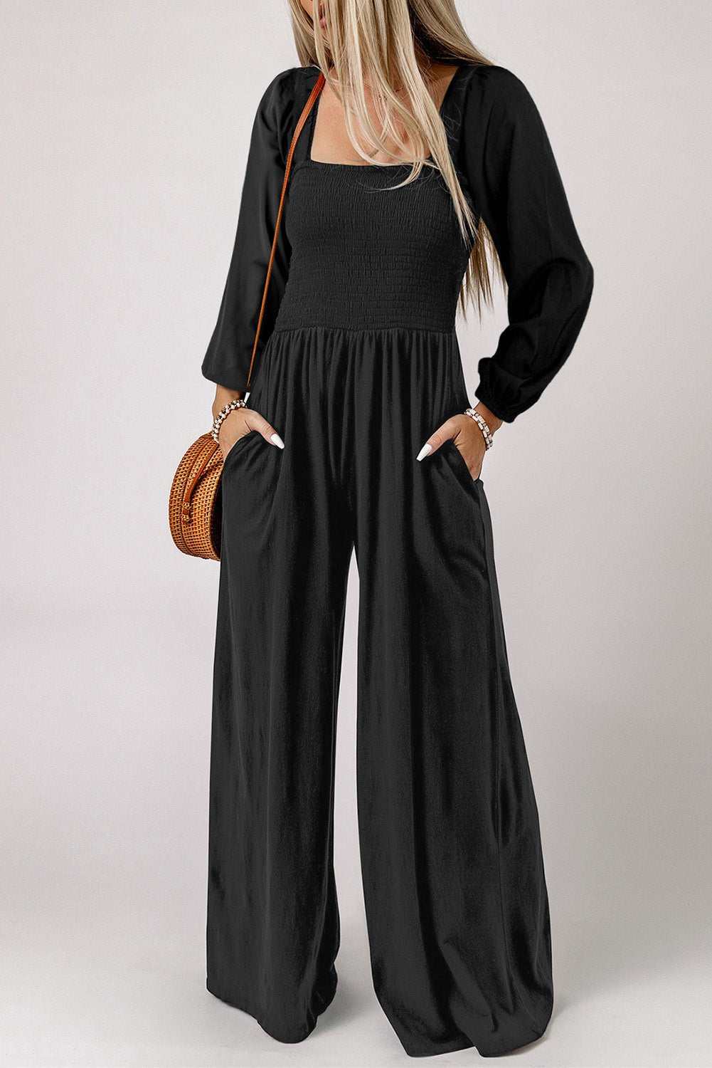 Square neck raglan sleeve jumpsuit with pockets in solid black color.
