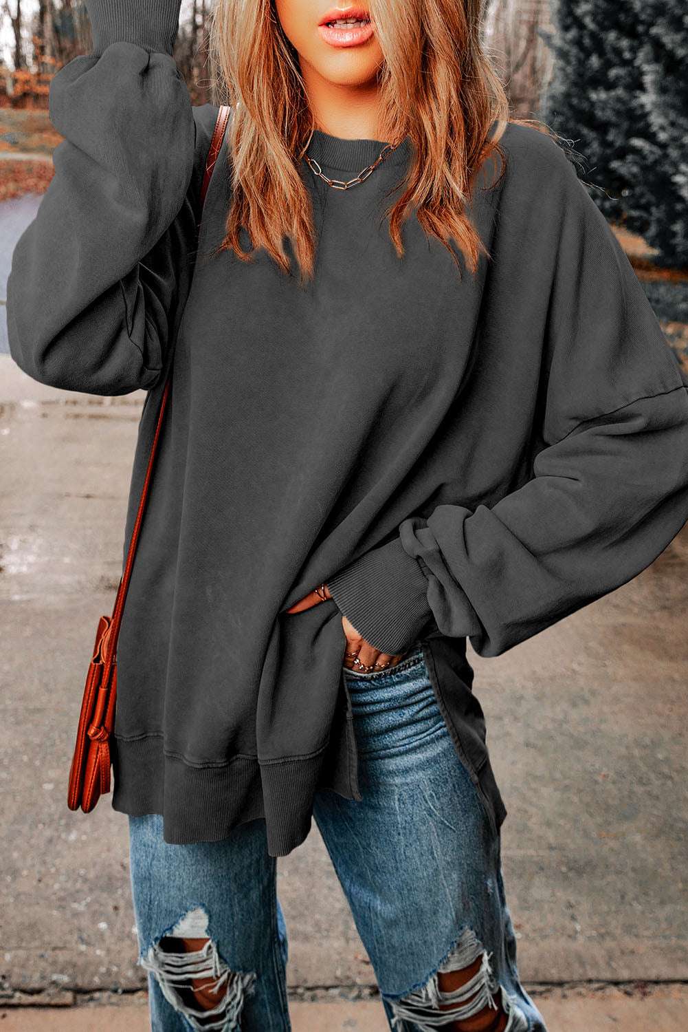 Casual dropped shoulder round neck long sleeve blouse in solid color.