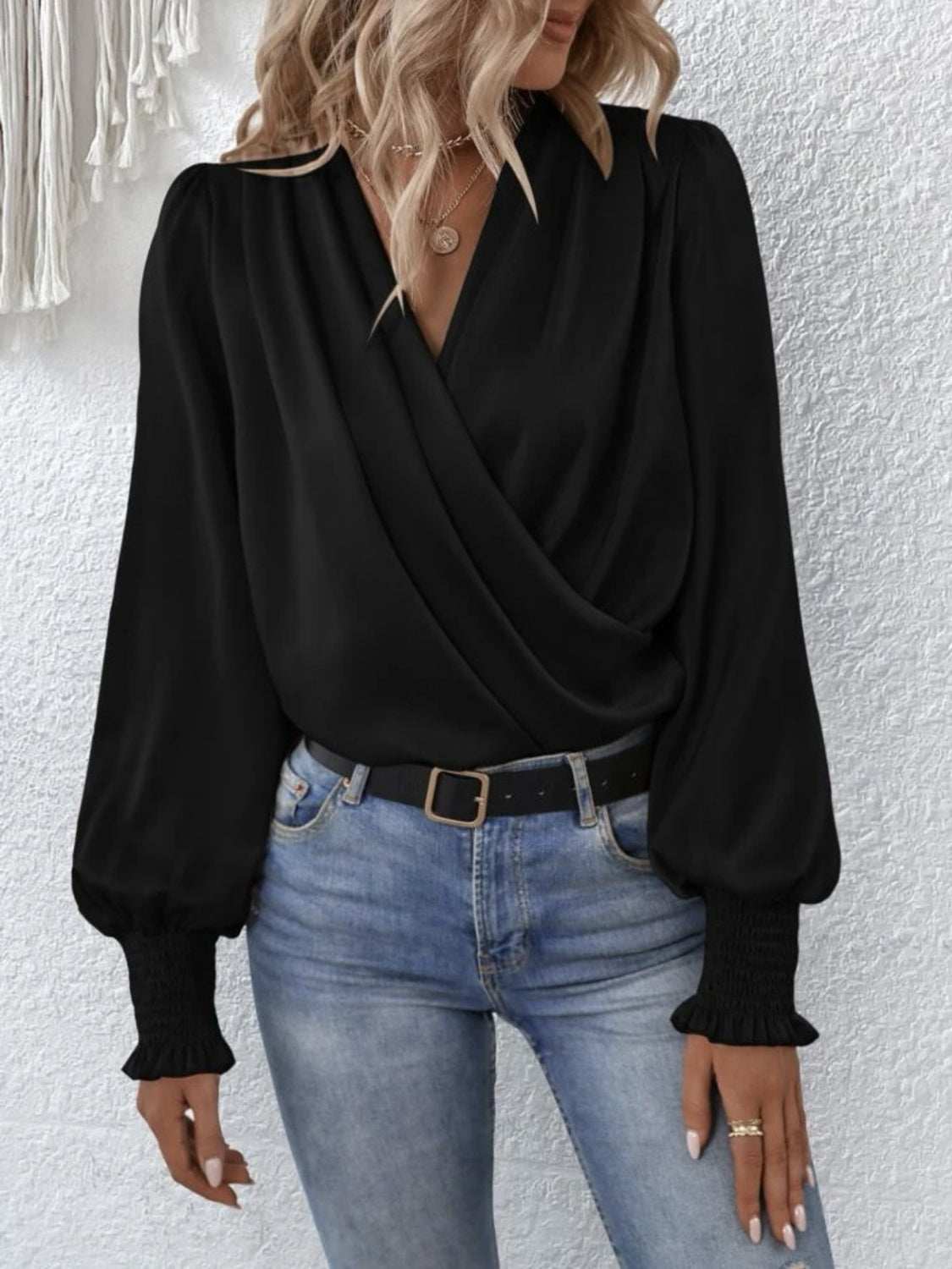 Surplice smocked lantern sleeve blouse in black, featuring a basic style and opaque fabric made of 100% polyester.
