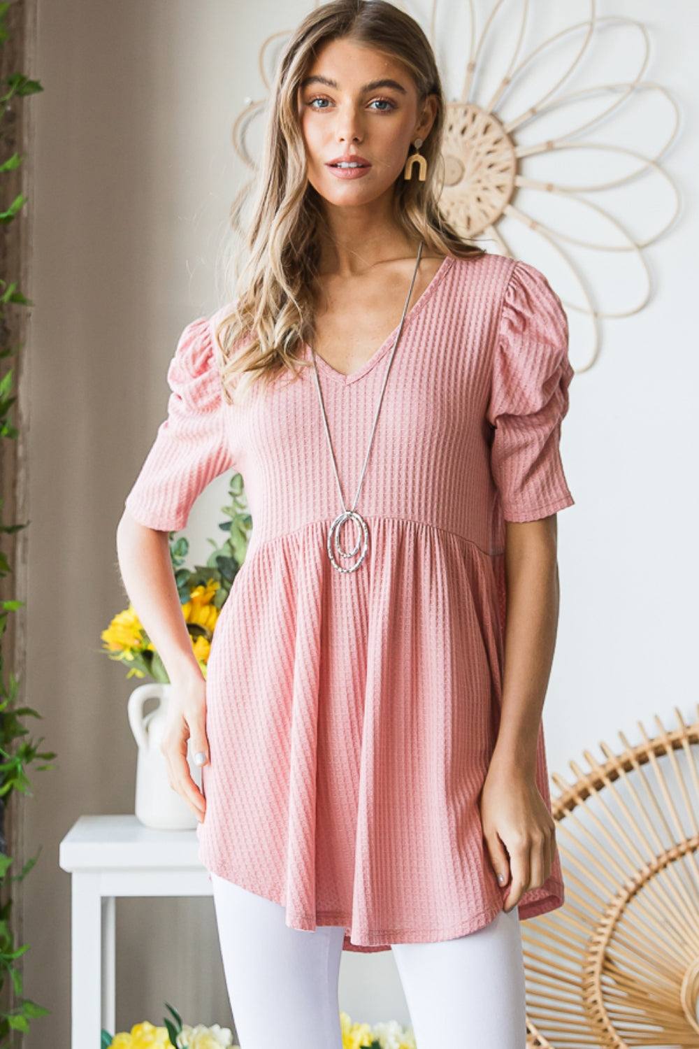 Heimish Full Size Waffle Knit V-Neck Babydoll Top in pink, featuring waffle texture and feminine design.