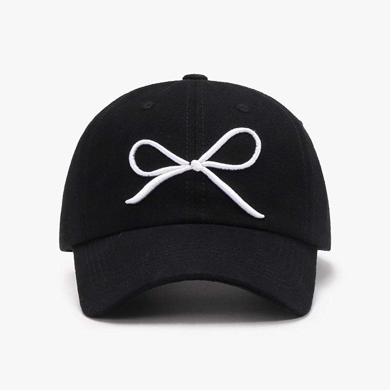 Bow embroidered cotton baseball cap, black, front view.