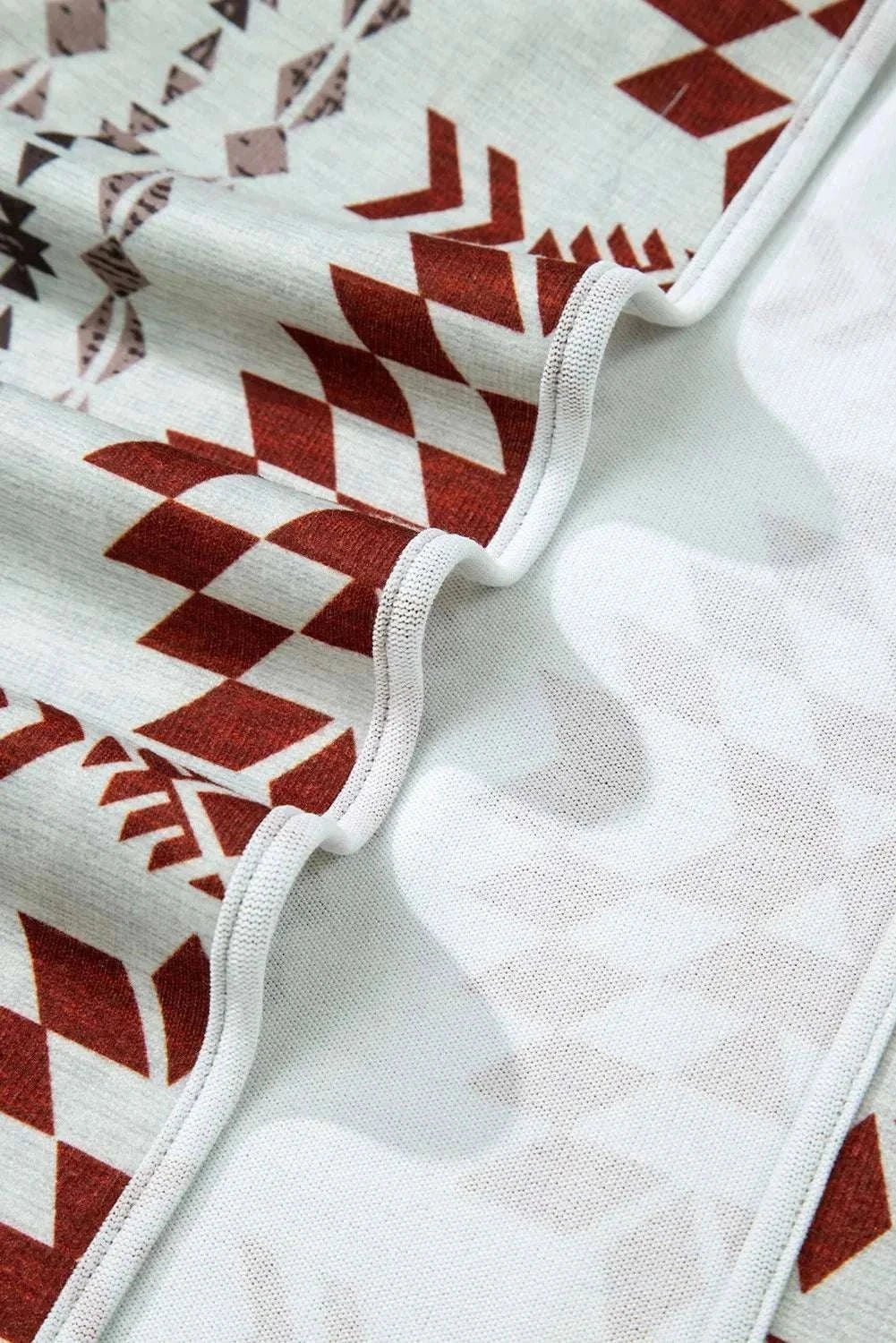 Geometric Open Front Long Sleeve Cover Up with abstract pattern detailing.