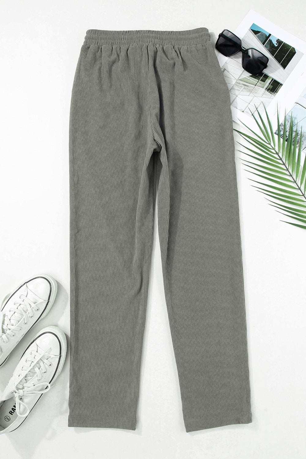 Gray drawstring straight pants with pockets, 100% polyester.
