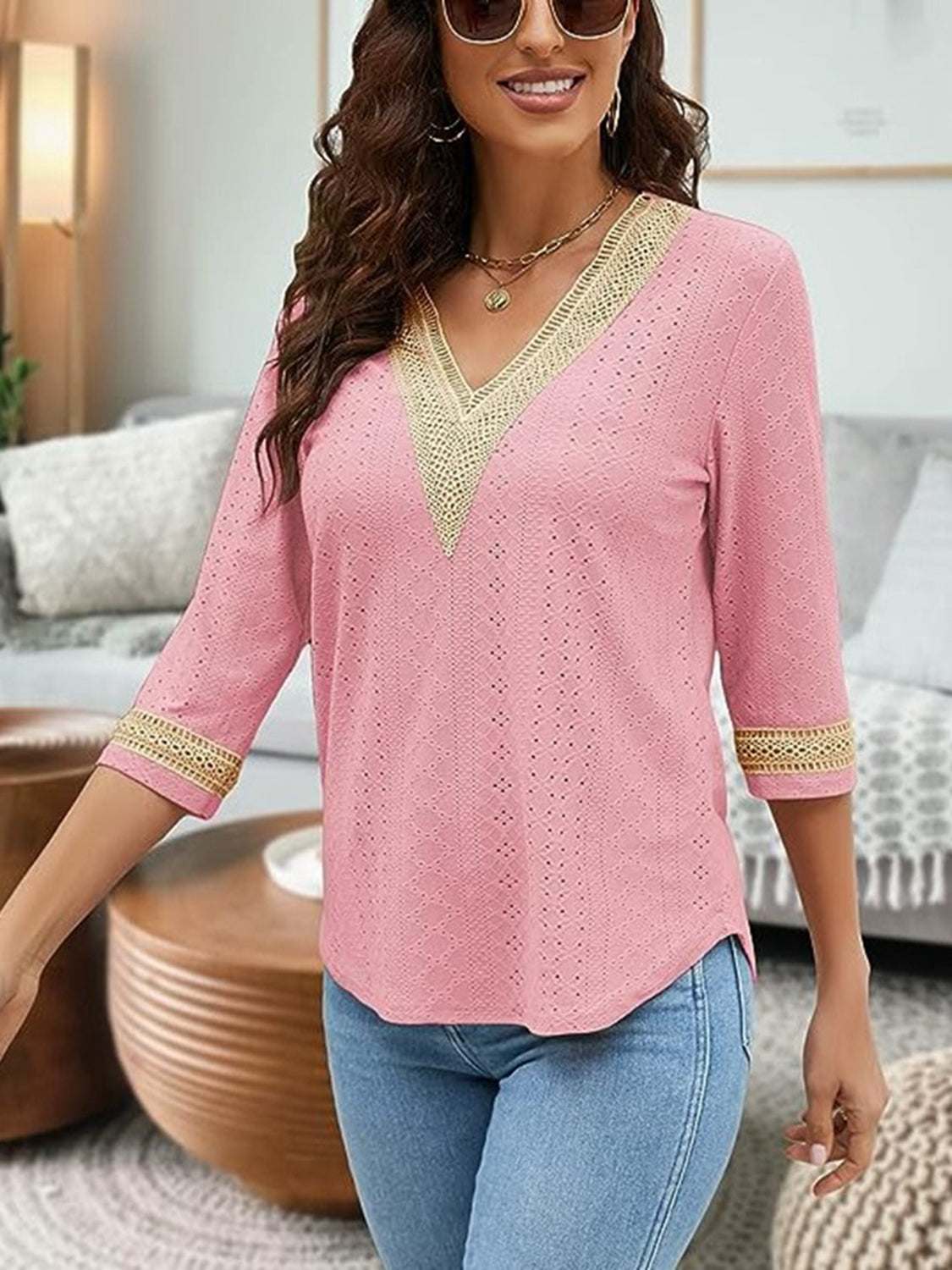 V-Neck Eyelet Blouse in pink with V-neck design, 3/4 sleeves, and decorative trim.