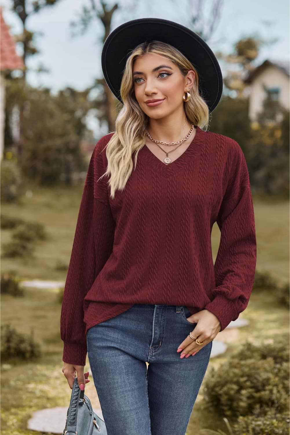 V-Neck Dropped Shoulder Blouse with long sleeves, casual solid pattern.