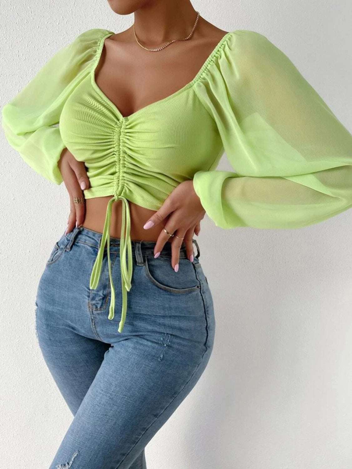 Drawstring sweetheart neck cropped top in light green, semi-sheer fabric, pullover style.