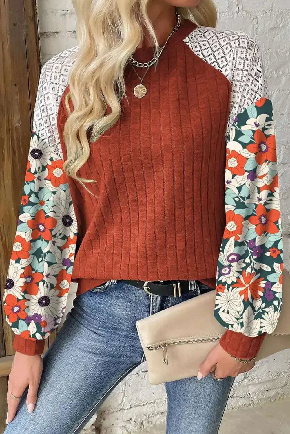Printed round neck long sleeve top with floral sleeves, slightly stretchy polyester blend, casual style.