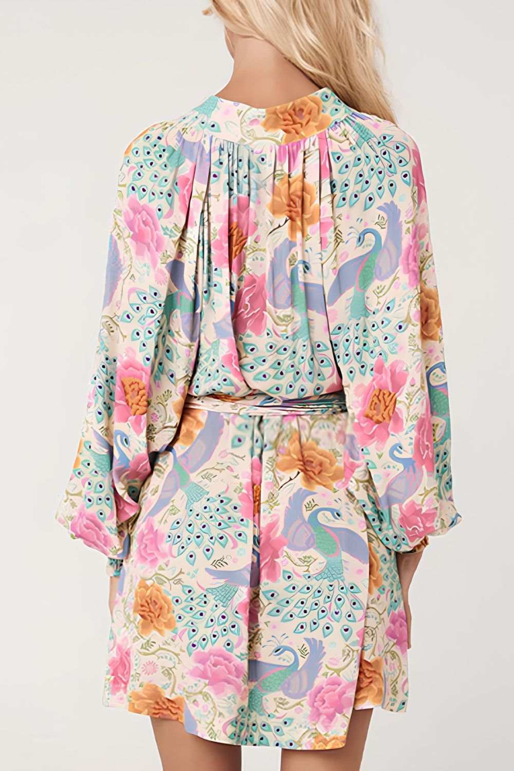 Printed notched lantern sleeve dress with colorful floral pattern.