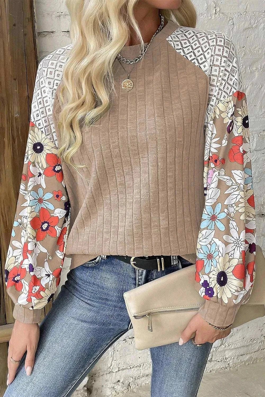 Printed round neck long sleeve top with colorful floral sleeves, slightly stretchy material.