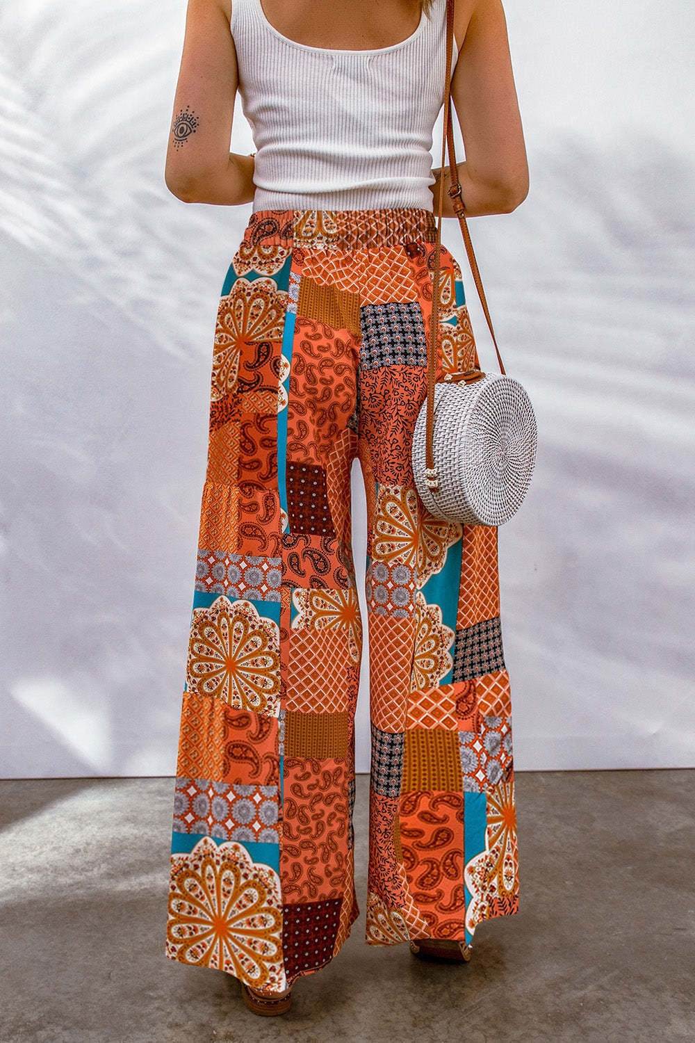 Full size drawstring printed wide leg pants in colorful patchwork design.