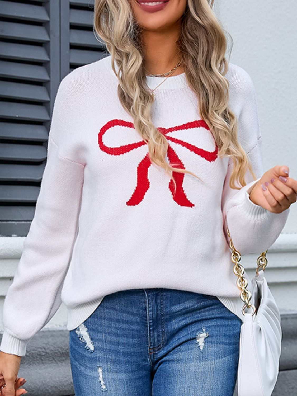 Angel Wings Bow Graphic Round Neck Long Sleeve Sweater in white with a red bow design.