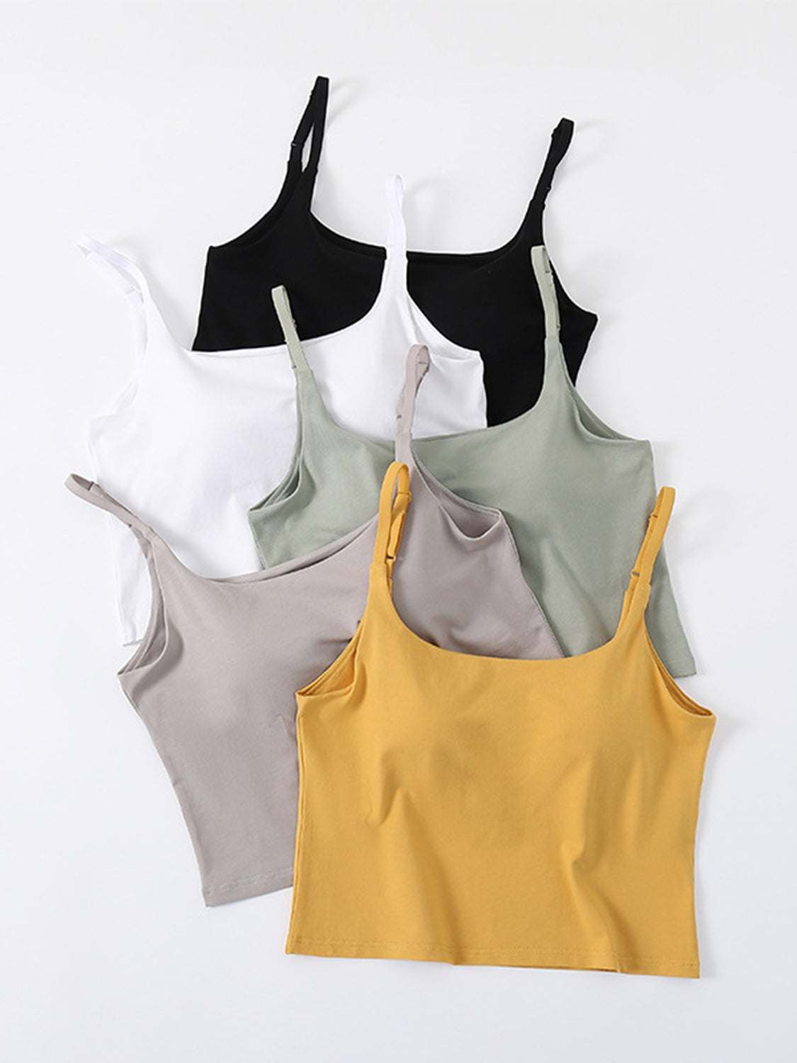 Scoop neck cropped cami with chest pads in various colors, featuring basic style and high stretch.
