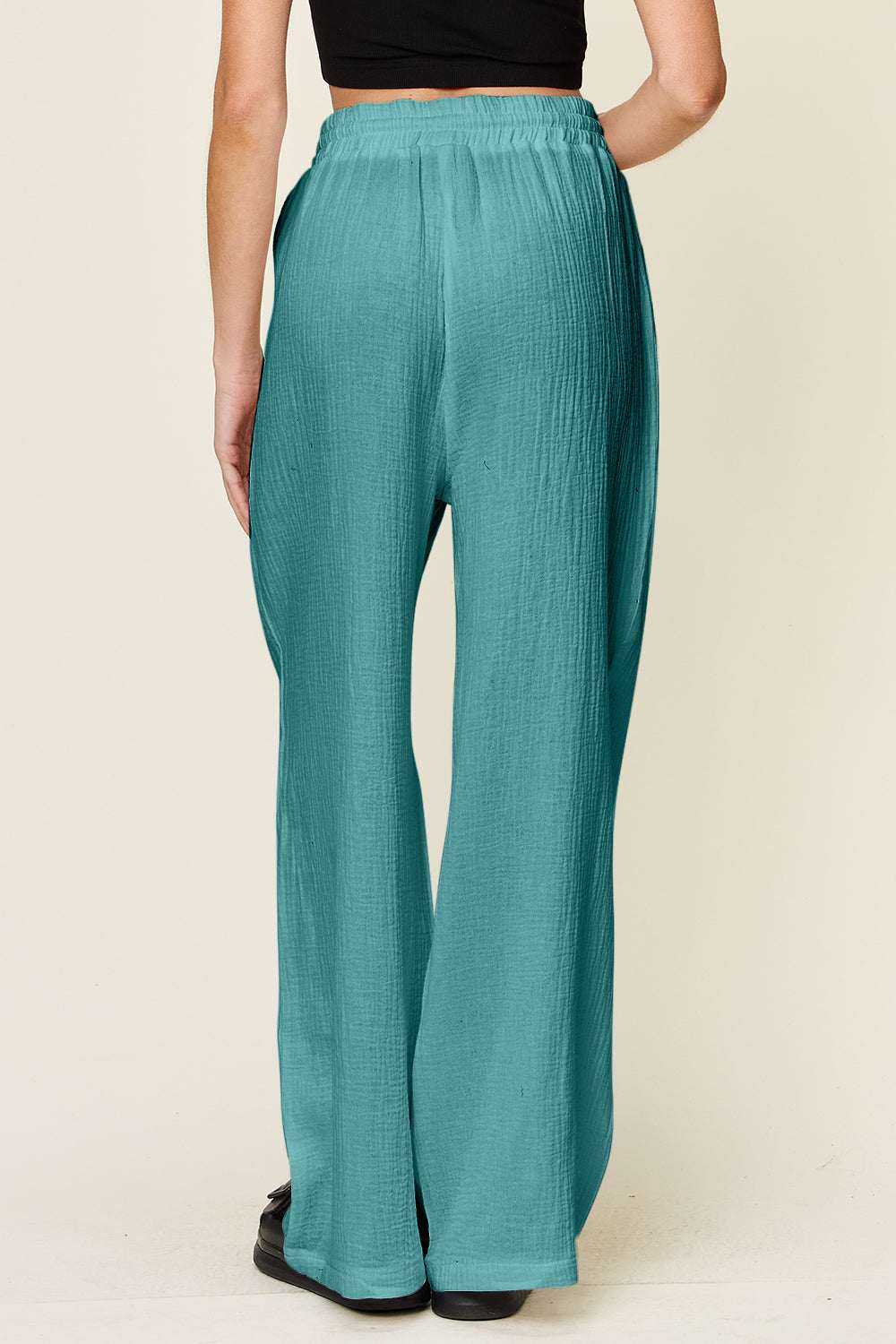Double Take Full Size Texture Drawstring Wide Leg Pants in teal, 100% cotton, opaque, back view.
