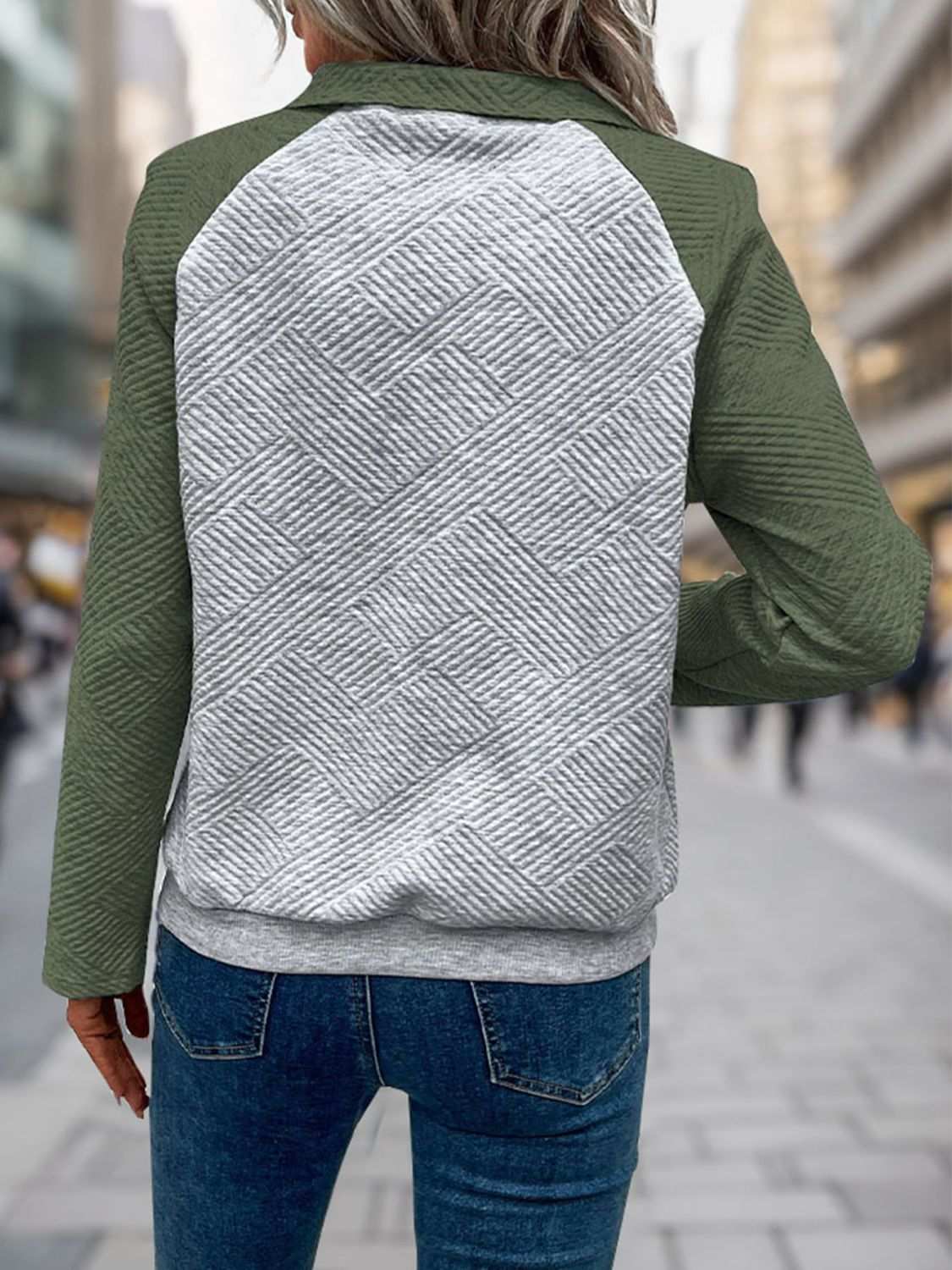 Perfee Contrast Textured Long Sleeve Sweatshirt with buttoned design and pockets, featuring green sleeves and patterned gray back.