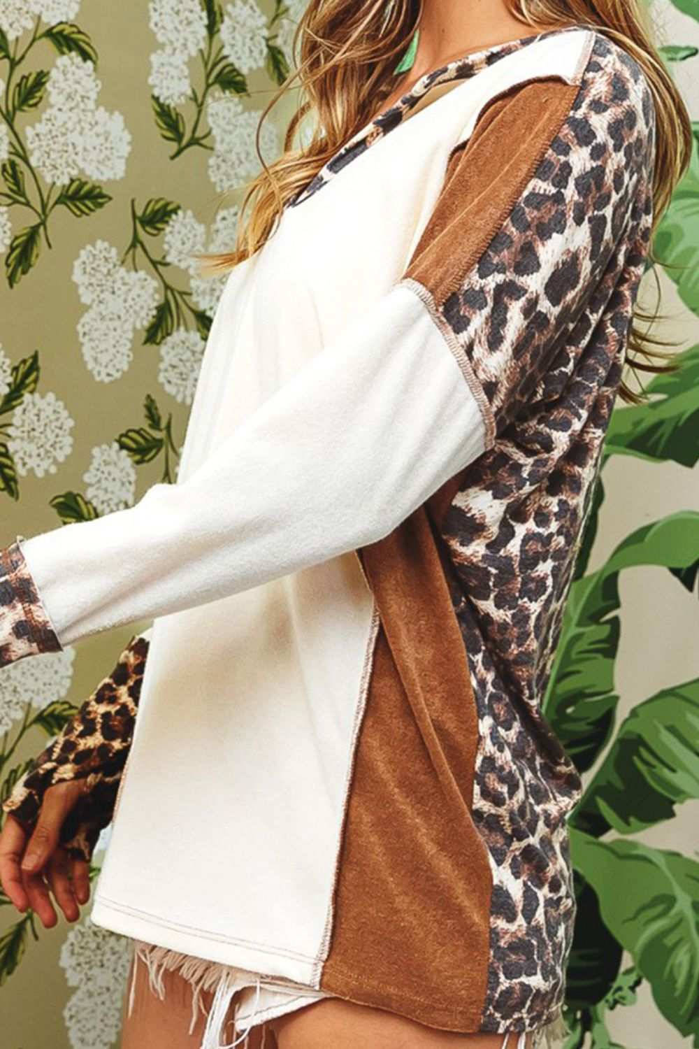 Leopard V-neck dropped shoulder blouse with a basic style and slightly stretchy material.