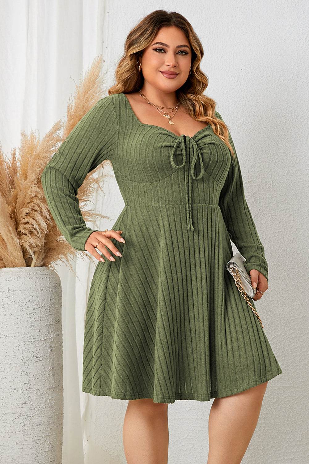 Plus size sweetheart neck long sleeve ribbed dress in olive color.