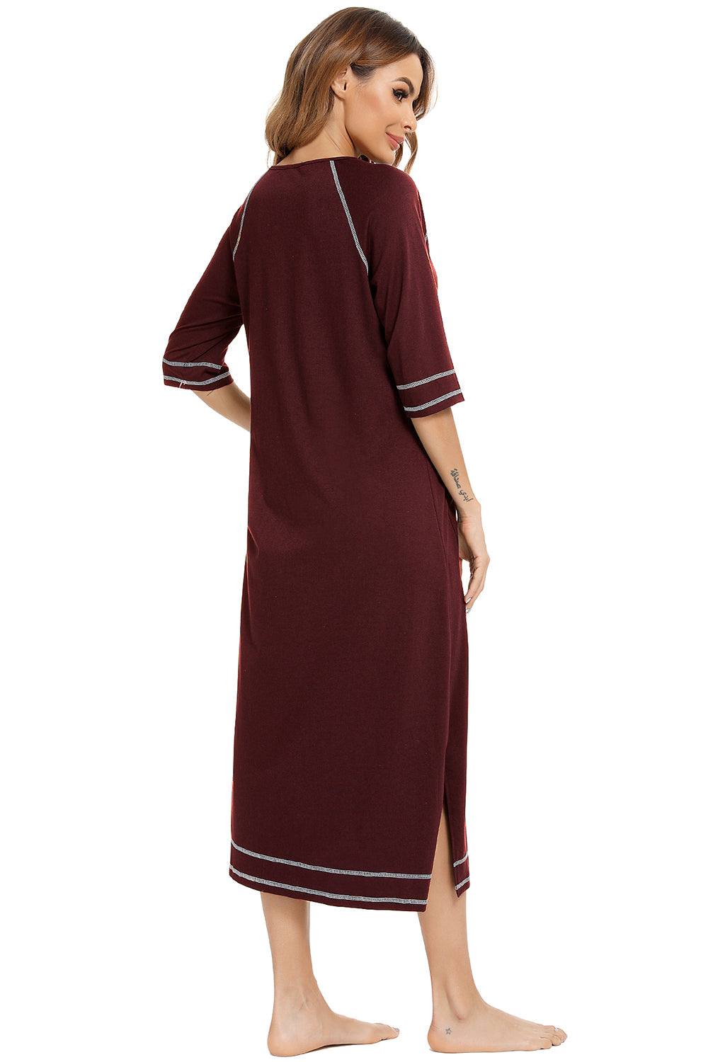 Women's slit round neck night dress with pockets, featuring a zip-up design and slight stretch material, in maroon.
