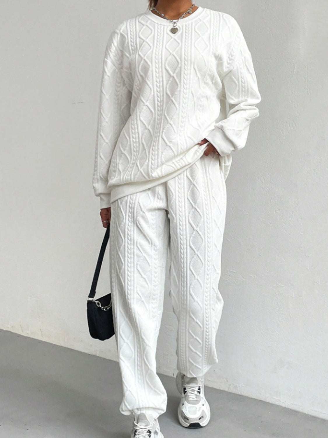White textured round neck top and pants set with slight stretch, made from 100% polyester, two-piece basic style outfit