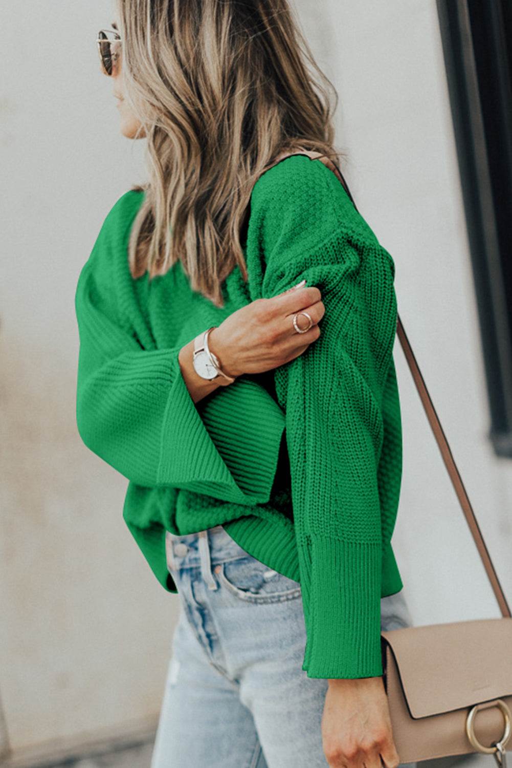 Textured round neck long sleeve green sweater with slight stretch and slit detail.