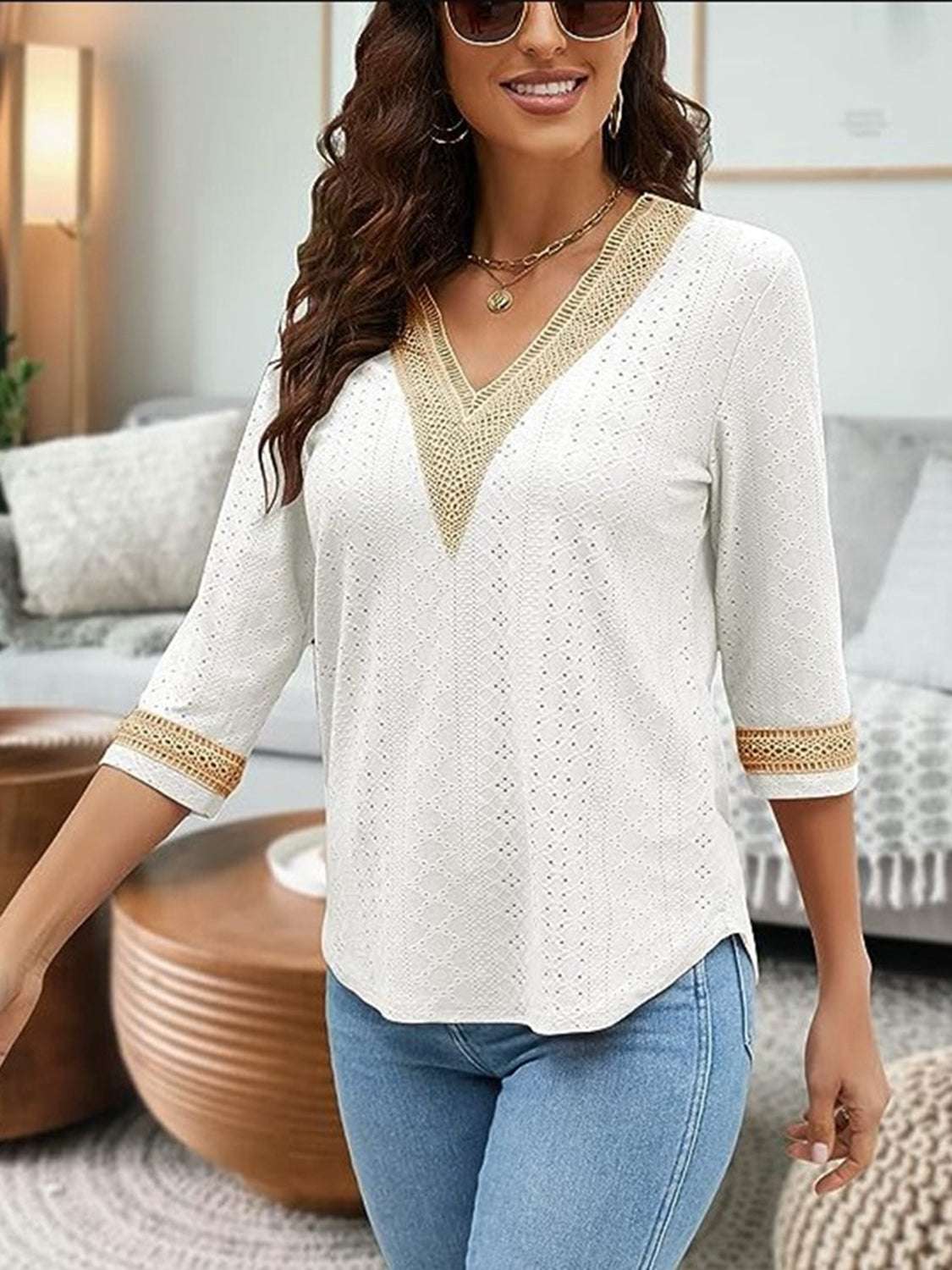 V-Neck Eyelet Blouse in white with 3/4 sleeves and eyelet detailing, made of 100% polyester.