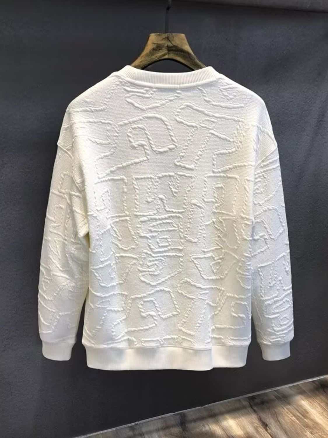 Men's plus size white textured long sleeve sweatshirt on hanger.