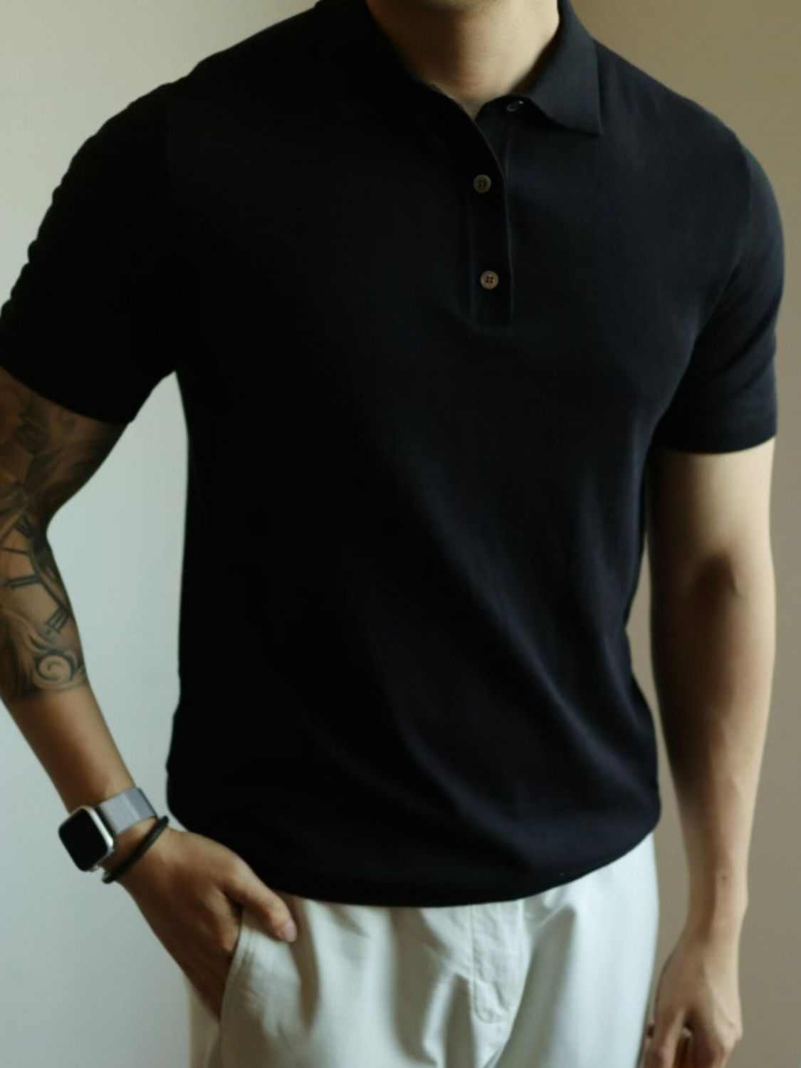 Men's plus size short sleeve polo with button detail in black.