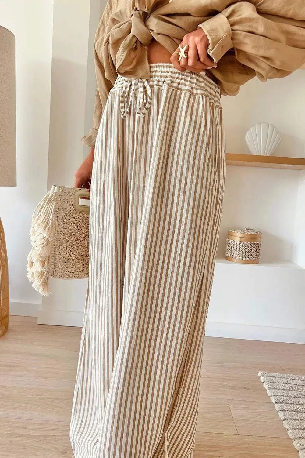 Plus size striped wide leg pants with drawstring, 100% polyester.