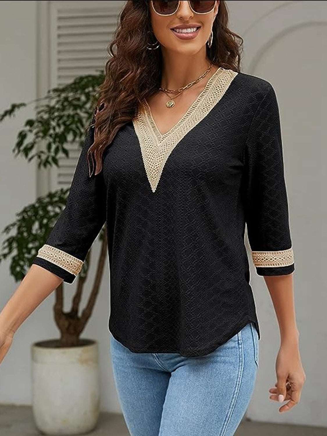 V-Neck Eyelet Blouse with basic style and no stretch, in black polyester.