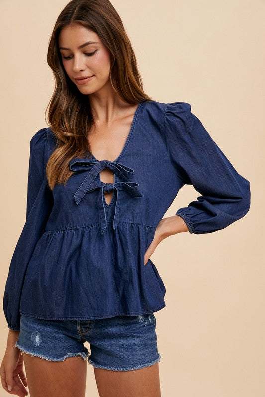 Annie Wear Tie Front Peplum Long Sleeve Denim Top with feminine tie detail and flattering silhouette.
