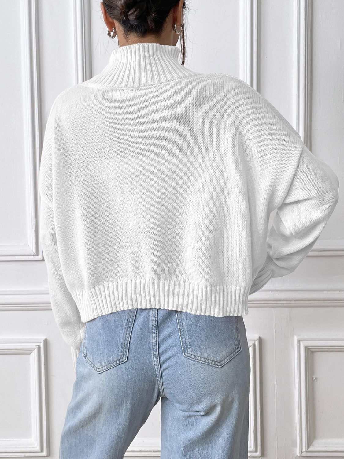 Bow Turtleneck Long Sleeve Sweater in white, rear view showing ribbed hem and collar.