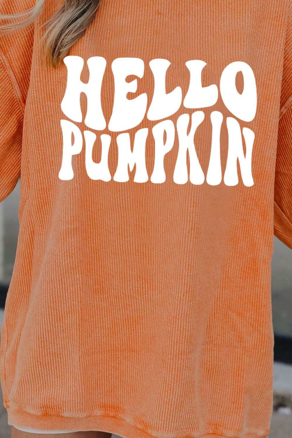 Round neck dropped shoulder sweatshirt with "HELLO PUMPKIN" graphic in casual style.