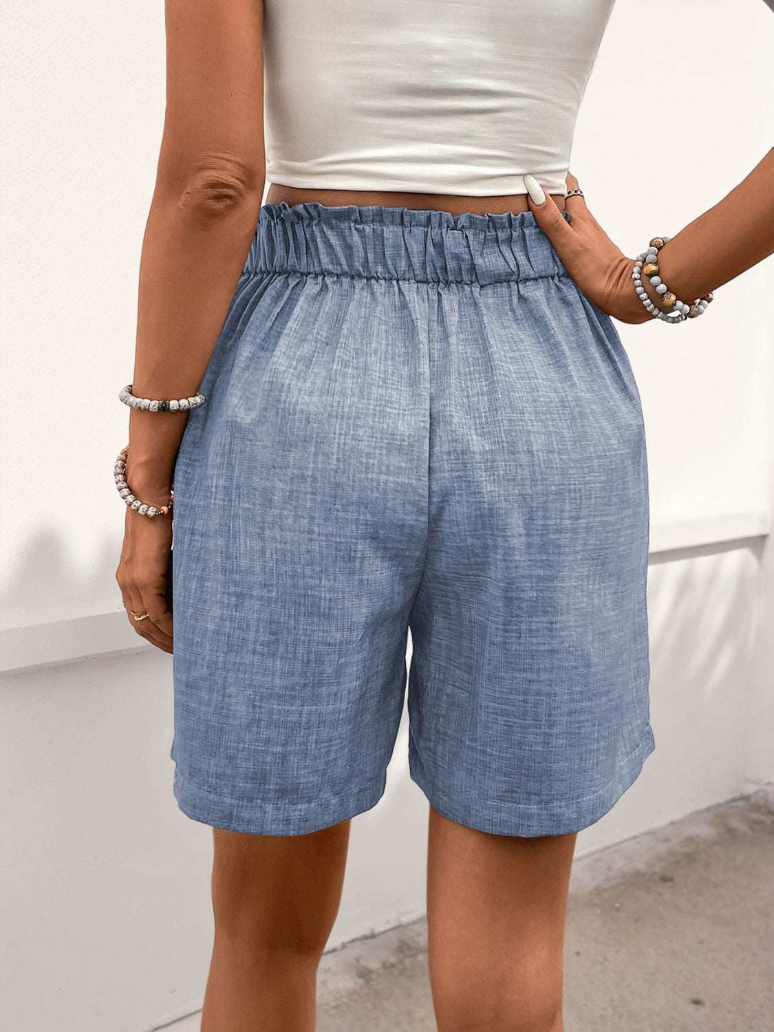 Perfee Frill Shorts with Pockets in blue, buttoned, pocketed, 100% polyester.