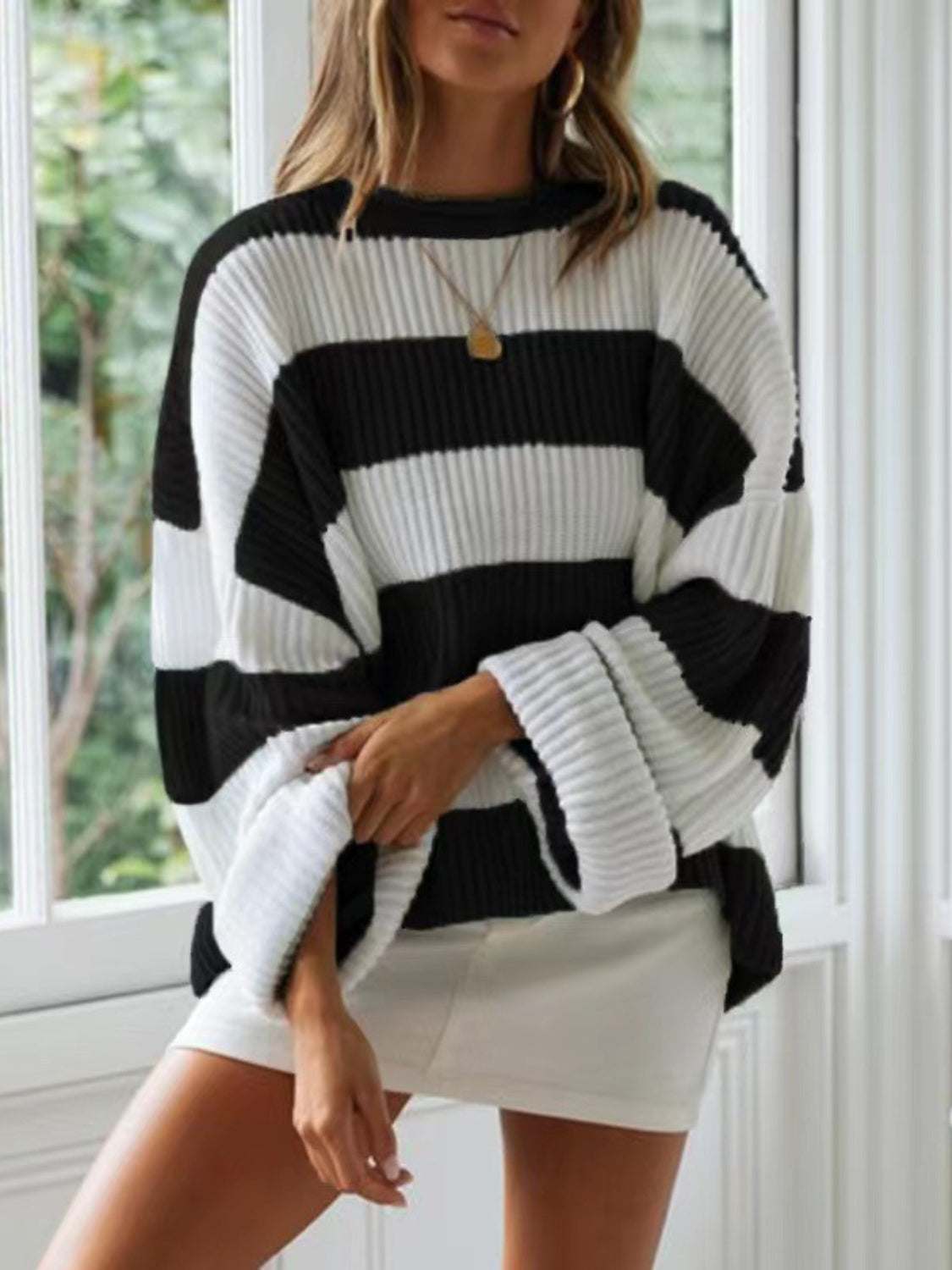 Round neck long sleeve sweater, black and white striped, slightly stretchy, 100% polyester.