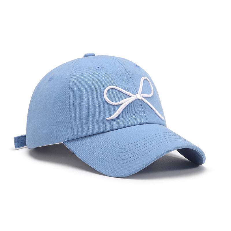 Bow Embroidered Cotton Baseball Cap in blue with adjustable strap.