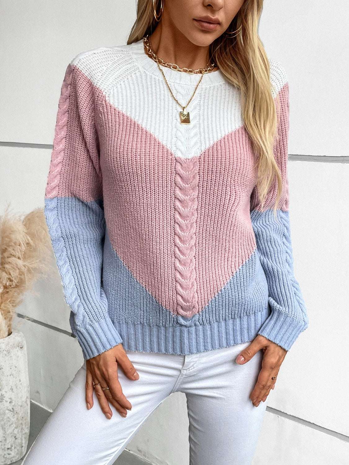 Color block round neck long sleeve sweater in pink, blue, and white.