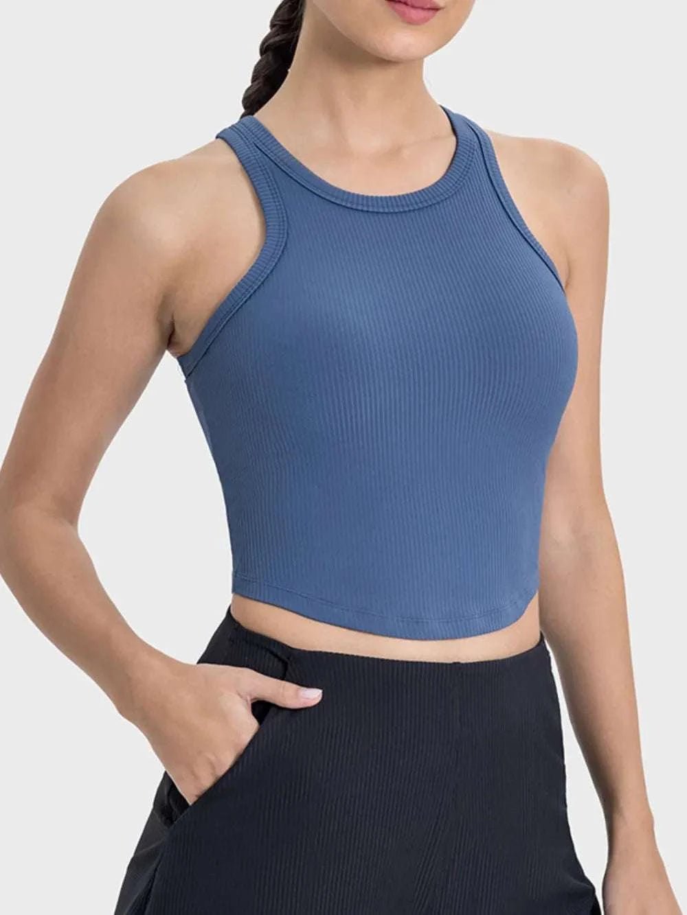 Millennia Round Neck Racerback Active Tank in blue, featuring a basic style with moderate stretch.