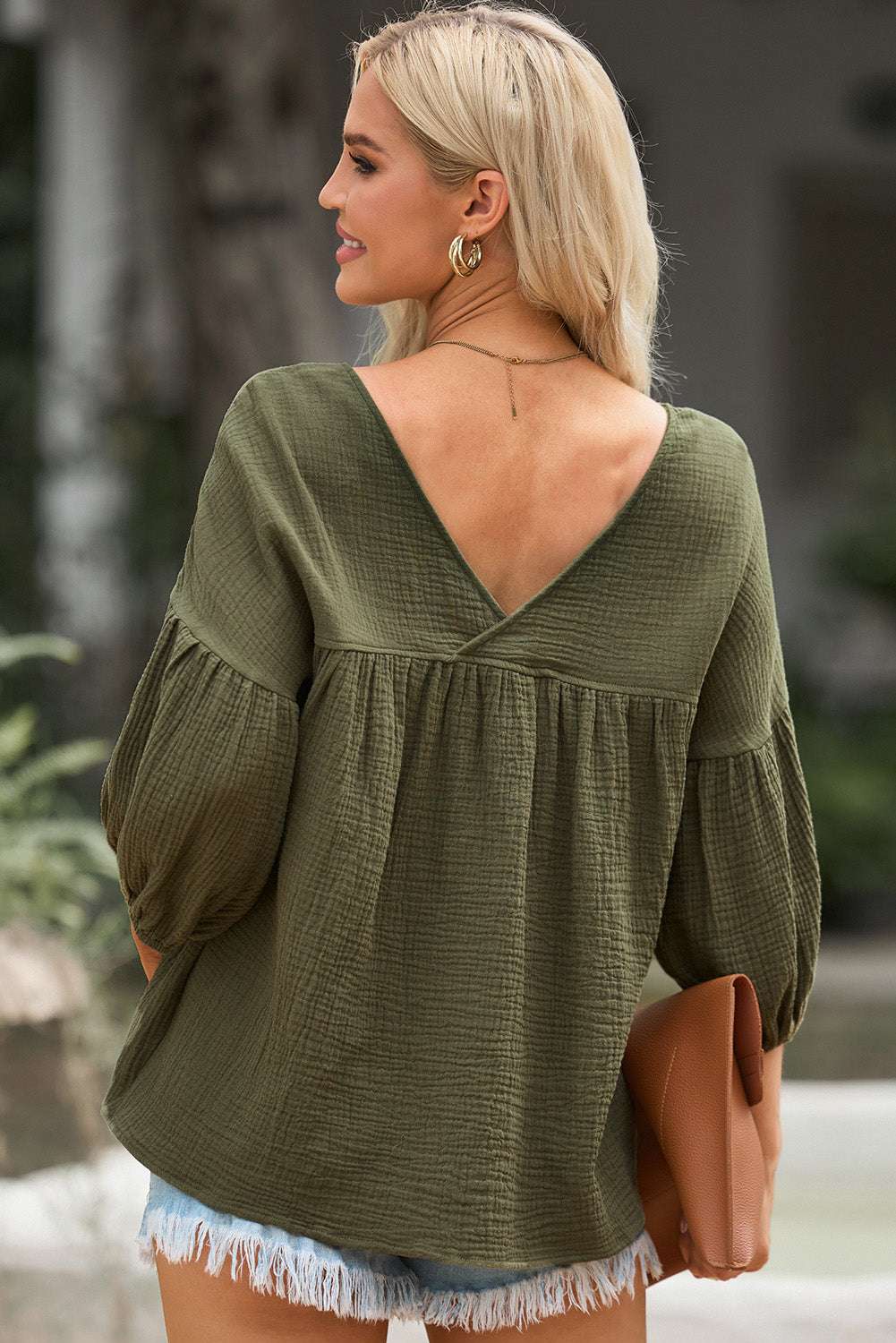 Casual solid V-neck blouse with long dropped shoulder sleeves, made from 100% cotton.
