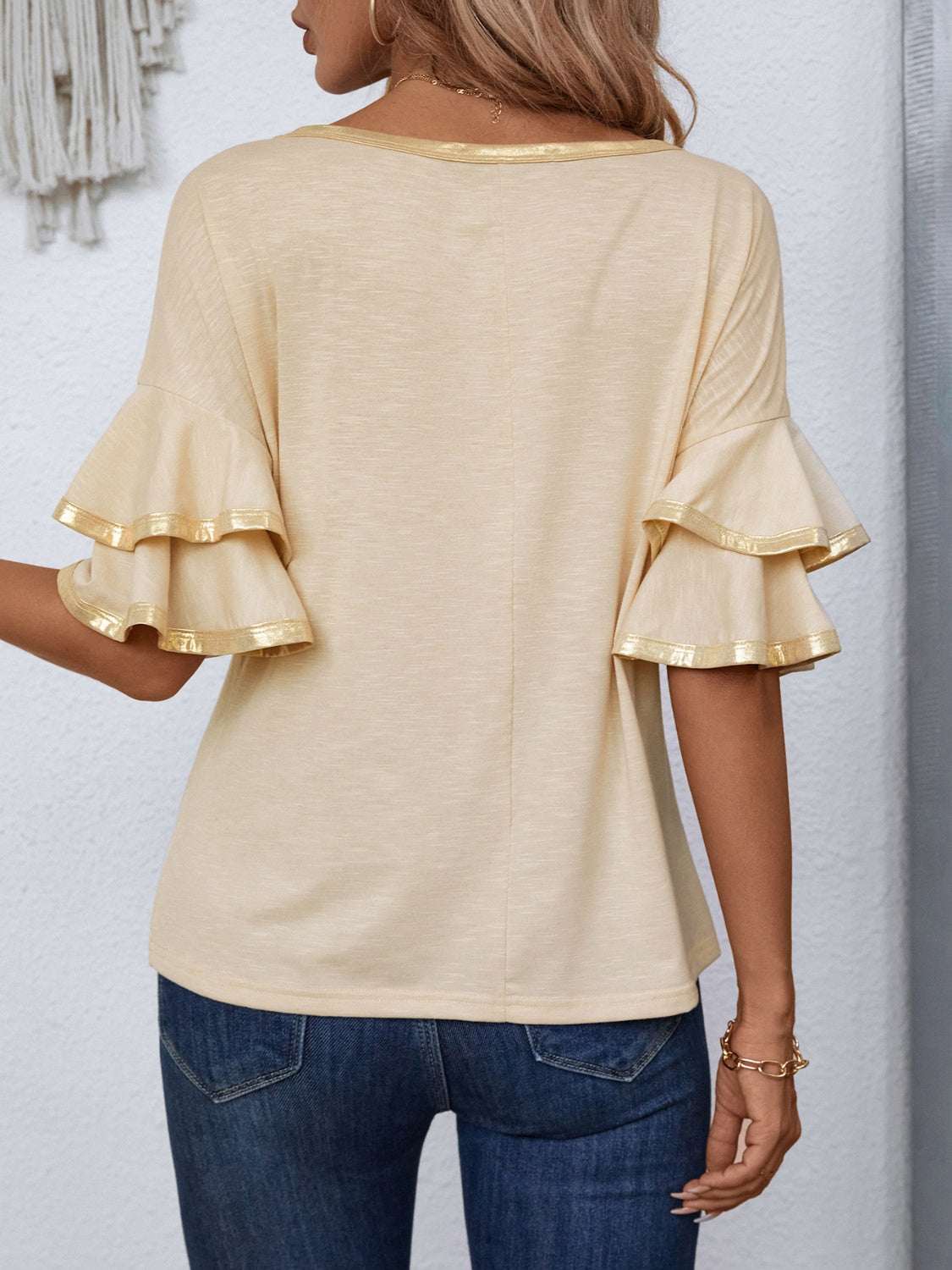 Round neck flounce sleeve T-shirt with ruffled design in beige, back view.