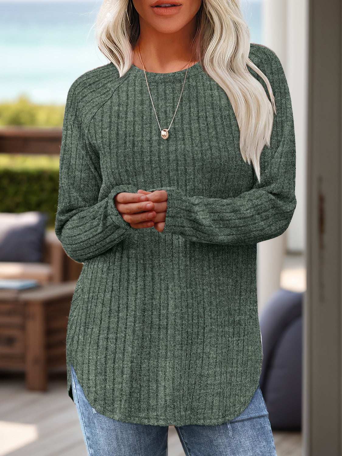 Round neck raglan sleeve T-shirt with slit detail, slightly stretchy, machine washable, and made of rayon and polyester.