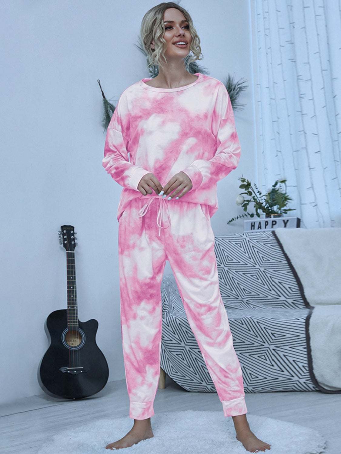 Shiny tie-dye round neck lounge set with long sleeves and pants in pink and white.