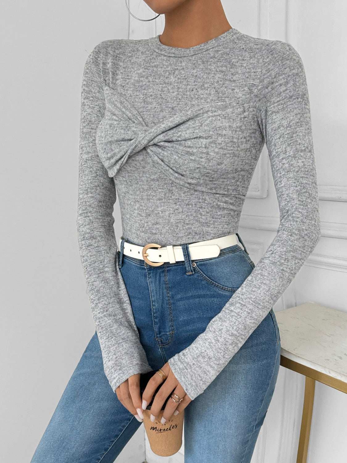 Perfee Twisted Round Neck Long Sleeve T-Shirt in gray, highly stretchy fabric, model wearing jeans.