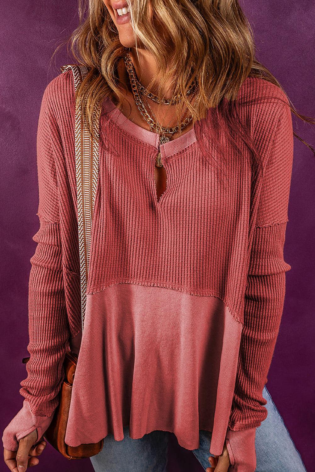 Notched neck long sleeve slit blouse in pink with layered design and slightly stretchy fabric.