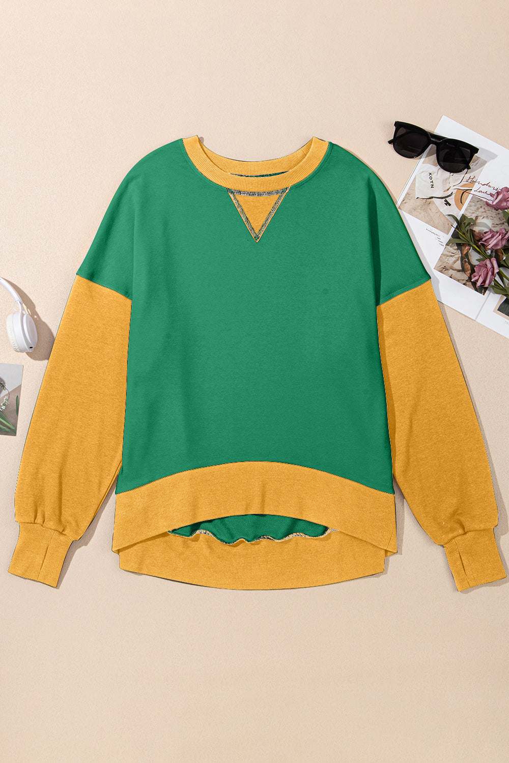 Contrasting round neck long sleeve sweatshirt in green and yellow with no stretch.