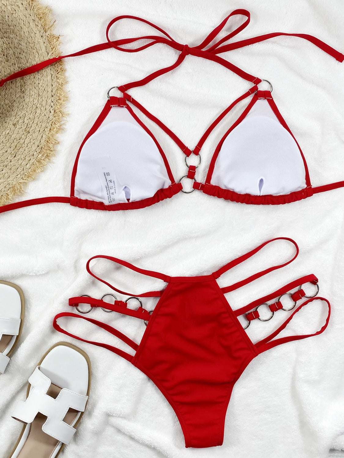 Cutout halter neck two-piece bikini set with removable padding in red.