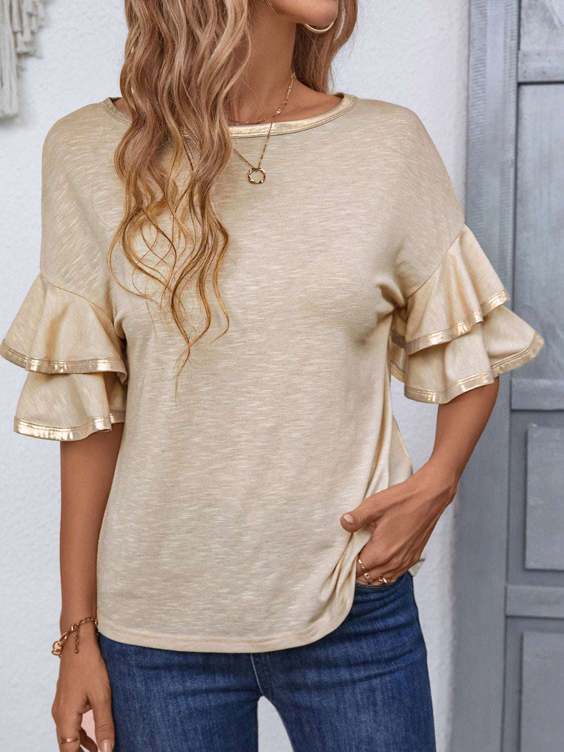 Round neck flounce sleeve T-shirt with ruffled detailing, highly stretchy material, and machine washable fabric.